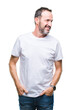 © Krakenimages.com - Middle age hoary senior man wearing white t-shirt over isolated background looking away to side with smile on face, natural expression. Laughing confident.