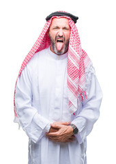 Poster - Senior arab man wearing keffiyeh over isolated background sticking tongue out happy with funny expression. Emotion concept.