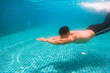 Young athlete man in swimming pool. Swim exercise.