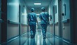 © volga - Female medical staff walking through hospital corridor