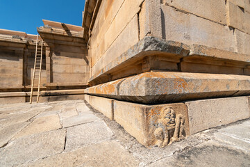 Wall Mural - A lion carving at the base of an ancient stone temple in Shravanabelagola