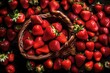 A top-down view of a basket overflowing with freshly picked strawberries, their glossy exteriors and deep red tones beautifully presented in striking