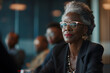 african american businesswoman sitting at conference table, at group multiethnic briefing