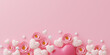 A pink background with a bunch of hearts and stars. The flowers are pink and white