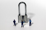 Fototapeta Kosmos - Lock and police miniatures against a white background. Privacy concepts, business, and security concepts.