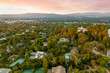© Wirestock - Aerial view of renovated Los Angeles houses among lush trees