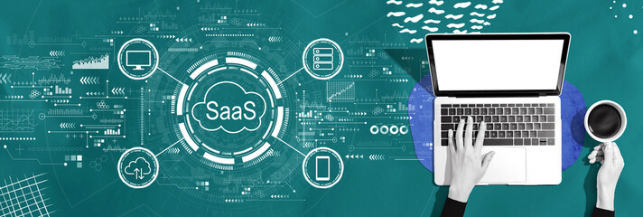 Sticker - SaaS - software as a service concept with person using a laptop computer