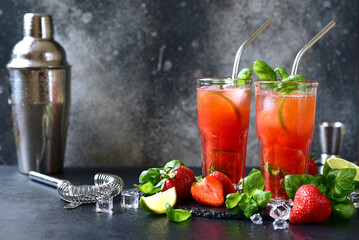 Wall Mural - Cold summer strawberry cocktail with lime and basil in a  glasses .