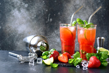 Wall Mural - Cold summer strawberry cocktail with lime and basil in a  glasses .