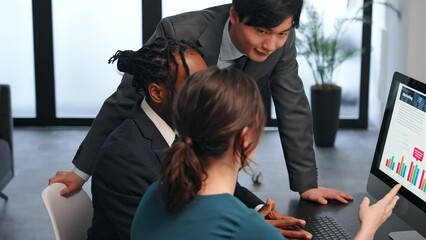 Poster - Multinational businesspeople talking while looking at PC monitor in the lobby. International business.