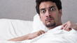 © Vitaliy - A man frightened in a dream wakes up and looks at the camera with huge bulging eyes