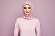 © MediaRaw - A woman wearing a pink hijab is smiling