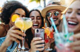 Fototapeta Uliczki - A group of friends taking a selfie while having drinks at an outdoor bar during summer, laughing and enjoying the party together