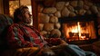 A man feeling peaceful and content while sitting by a crackling fireplace.