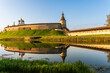 Pskov, Russia, September 11, 2023. Reflection of the walls of the old fortress in the water of the river.