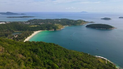 Wall Mural - Aerial flying pass cliff to reveal beautiful beach of Phuket, Thailand