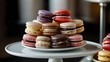A mouthwatering spread of gourmet desserts, including macarons, éclairs, tarts, and petits fours, arranged on a tiered dessert stand.