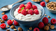 A picture-perfect yogurt bowl topped with a generous amount of fresh raspberries, an inviting option for a healthy treat