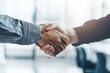 Close up of two business people shaking hands in the office