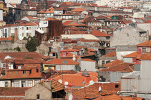 Cityscape Of Porto With Old Ancient Buildings, Orange Roofs And Rusty Walls Under Construction. Satellite Dish On The Roof Top.