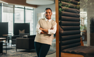 Wall Mural - Smiling female manager in coworking office looking at camera