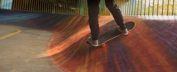 Wall Mural - Skateboarder skateboarding at skatepark in city