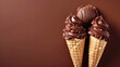 Two cones of chocolate ice cream with one scoop and swirled soft-serve against a brown background