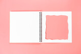Fototapeta Dziecięca - White notebook with cut-out frame on the page. Blank layout template of spiral notebook on pink background.