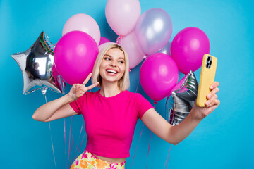 Sticker - Photo portrait of attractive young woman air balloons selfie v-sign amazed dressed stylish pink clothes isolated on blue color background