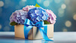 Mother's Day card with colorful hydrangea flowers in gift box on a blue background