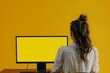 © Markus Schröder - Ui mockup through a shoulder view of a adult woman in front of a computer with a completely yellow screen