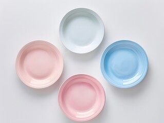 Wall Mural - Top view , Pink, Blue, and light Blue pastel coloured plates on white background 