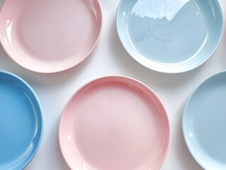 Wall Mural - Top view , Pink, Blue, and light Blue pastel coloured plates on white background 