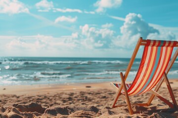 Poster - A beach chair sitting on top of a sandy beach. Suitable for vacation or travel concepts