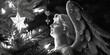 A striking black and white photo of an angel statue. Perfect for religious or memorial designs