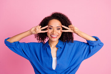 Sticker - Photo of cheerful crazy cute woman wear blue trendy clothes two hands v-sign isolated on pink color background