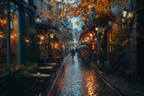 Fototapeta Fototapeta uliczki - A traveler exploring narrow cobblestone streets lined with charming cafes and boutiques.Person strolling down rainsoaked cobblestone street in city with umbrella