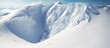 Skiers descend steep snowy mountain under blue sky
