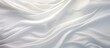 Flowing white fabric with abundant folds