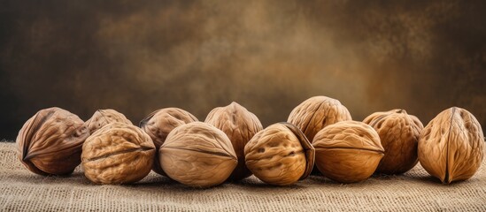 Poster - Shelled walnuts on rustic burlap