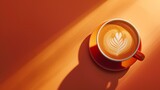 The rich aroma of freshly brewed coffee fills the air as morning sunlight streams through the window, casting a warm glow on the orange cup and saucer