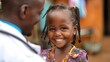 A woman in a white coat is smiling at a young girl