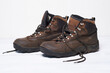 Pair of Brown Hiking Boots on White Floor
