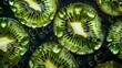 Sliced kiwi fruit with water droplets on dark background
