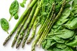 Asparagus Stalks and Spinach Leaves on White Background, Fresh Young Garden Asparagus