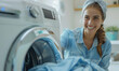 happy woman loading laundry machine with linen and clothes, female doing chores at home, domestic life