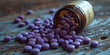 Spilled Purple Pills from Prescription Bottle on Wooden Surface