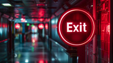 Red Exit Sign In A Corridor.