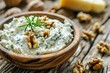Blue cheese spread on wood background with walnuts Focus on wood