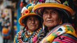 Women of Bolivia. Women of the World. Two indigenous women in traditional colorful attire pose for a portrait with a blurred background of cultural artifacts #wotw